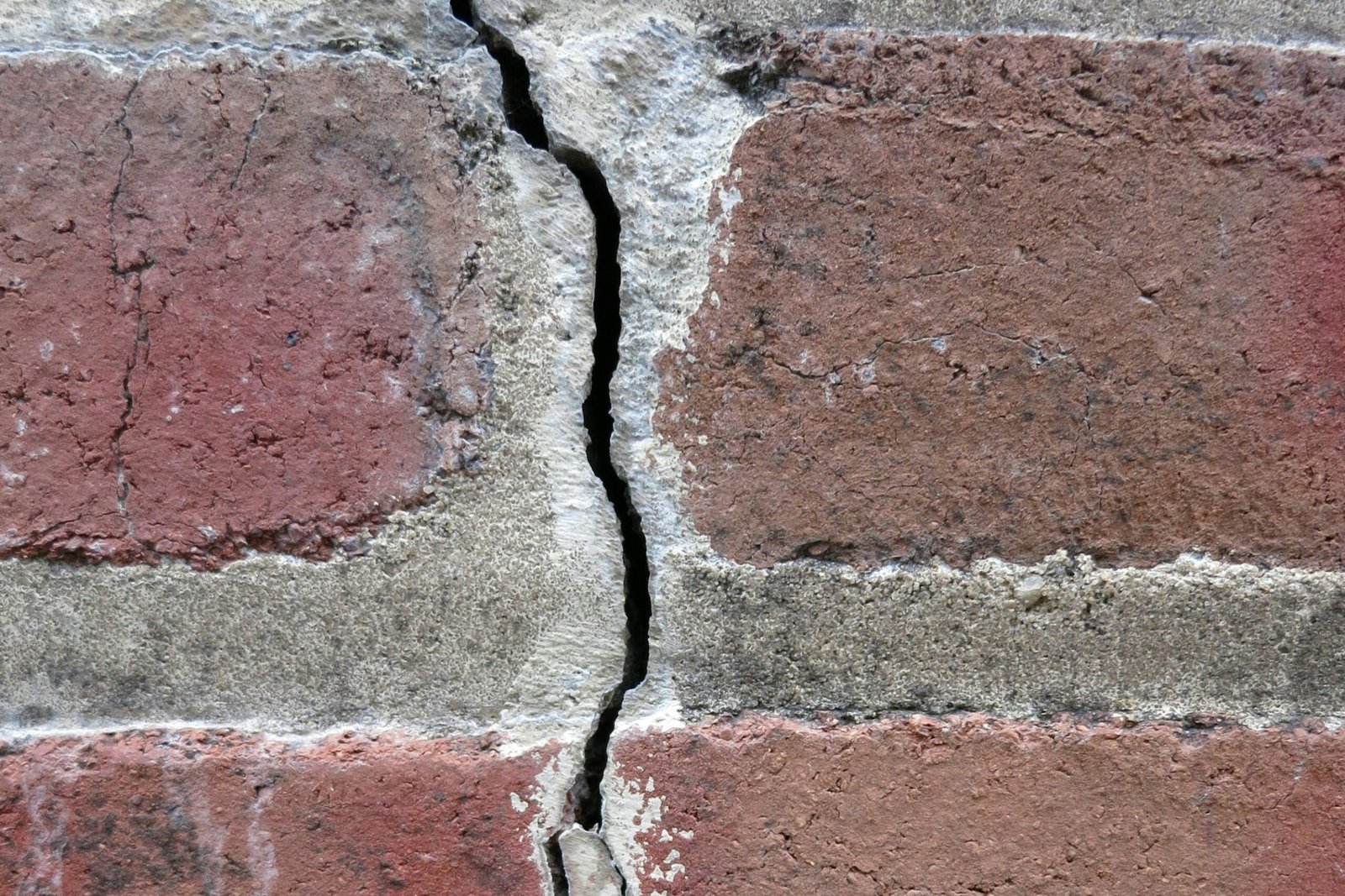 House with cracked brick