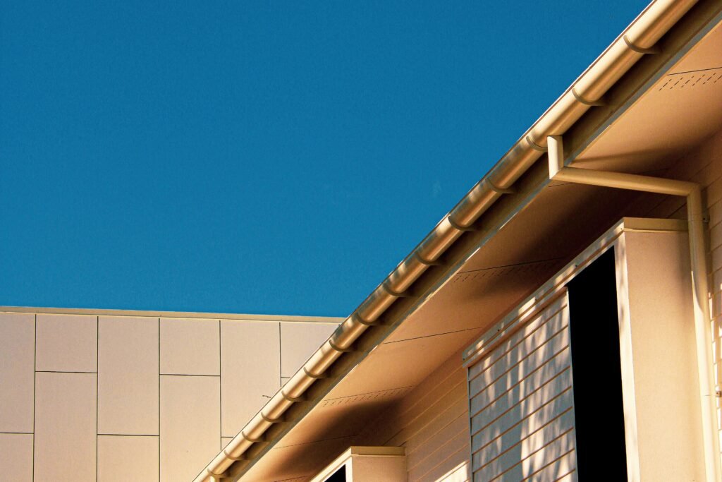 jed-wood-RPkBxmRjzms-unsplash Gutters on a house