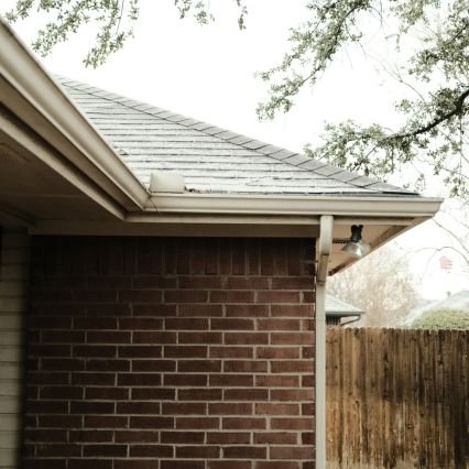 Gutter with rain falling