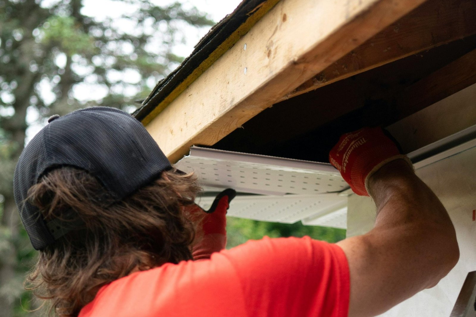 Man repairing a gutter